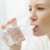 Woman drinking glass of water